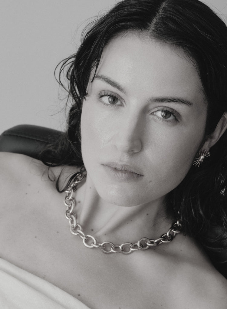 Black and white portrait with a silver chain